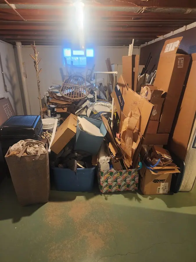 Roll-off dumpster container at job site for 2 Yard Dumpster Rental in Belmont